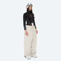 
                  
                    Women's 2-layer snowboard jacket and pants - cream snow pants, on-model front view, for skiing and snowboarding
                  
                