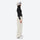 Women's waterproof 2L snow jacket and pants - cream snow pants, on-model side view, for resort and street wear