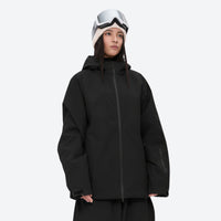 
                  
                    Women's 2-layer snowboard jacket and pants - black, on-model three-quarter front view, for resort and street wear
                  
                