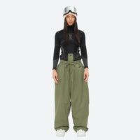 
                  
                    Women's minimalist breathable ski jacket set - olive green snow pants, on-model front view, for resort and street wear
                  
                