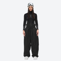 
                  
                    Women's waterproof 2L snow jacket and pants - black snow pants, on-model front view, for resort and street wear
                  
                