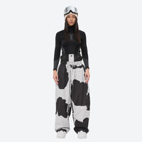 
                  
                    Women's waterproof 2L snow jacket and pants - cow print snow pants, on-model front view, for skiing and snowboarding
                  
                