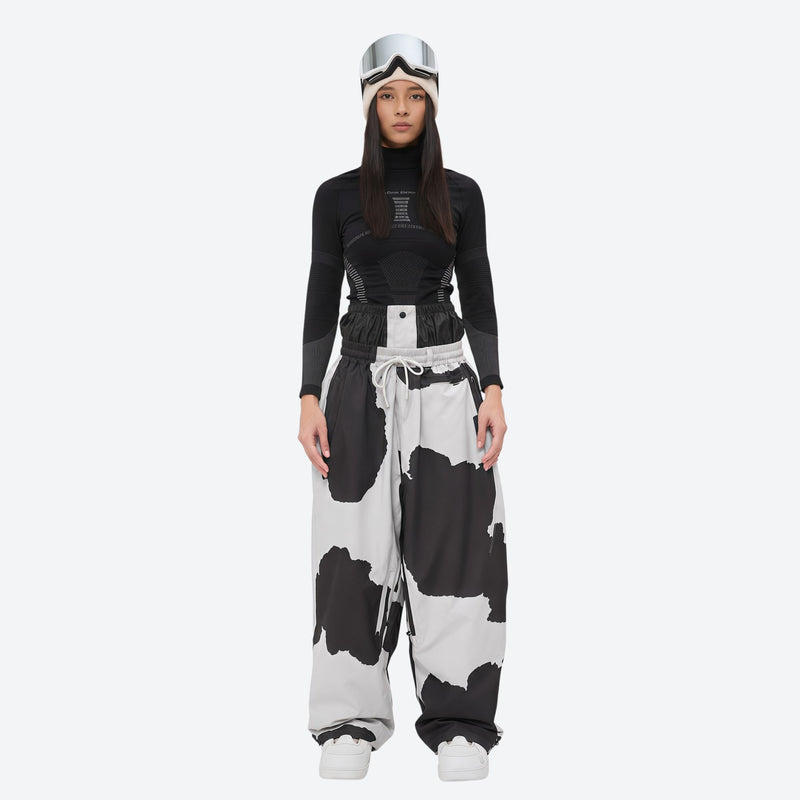 Women's waterproof 2L snow jacket and pants - cow print snow pants, on-model front view, for skiing and snowboarding