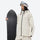 Women's waterproof 2L snow jacket and pants - cream, on-model front with upright snowboard, for cold-weather winter sports
