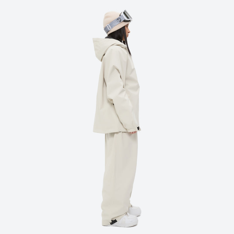Women's waterproof 2L snow jacket and pants - cream jacket with cream pants, on-model side view, for resort and street wear