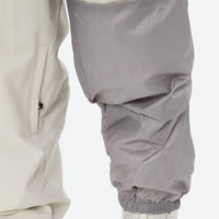 
                  
                    Women's waterproof 2L snow jacket and pants - cream snow pants, for cold-weather winter sports
                  
                
