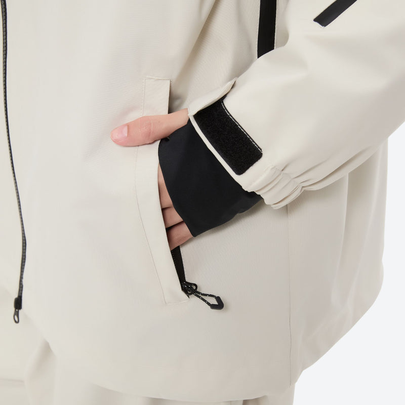 Women's waterproof 2L snow jacket and pants - cream, side pocket close-up with hand, for skiing and snowboarding