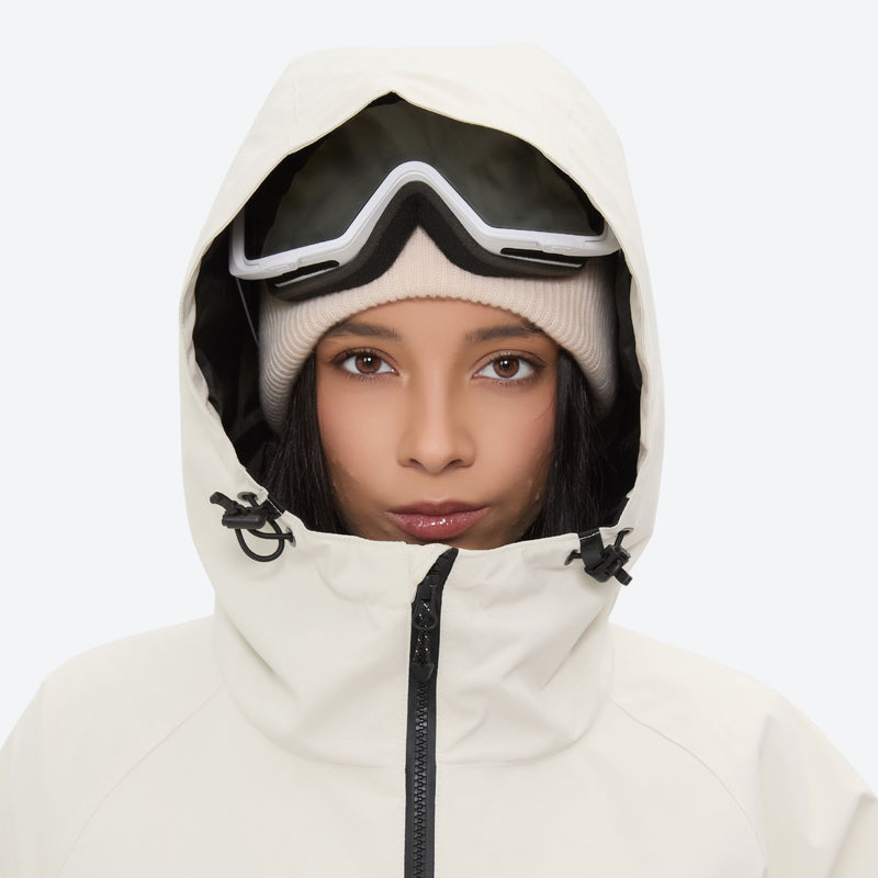 Women's 2-layer snowboard jacket and pants - cream, hood and face close-up with goggles, for skiing and snowboarding