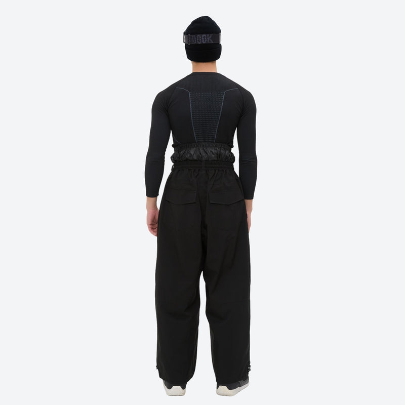 Men's minimalist breathable ski jacket set - black snow pants, on-model back view, for powder days and winter commute