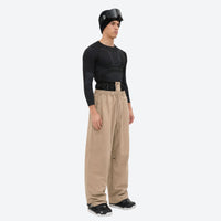 
                  
                    Men's 2-layer snowboard jacket and pants - tan snow pants, on-model side view, for cold-weather winter sports
                  
                