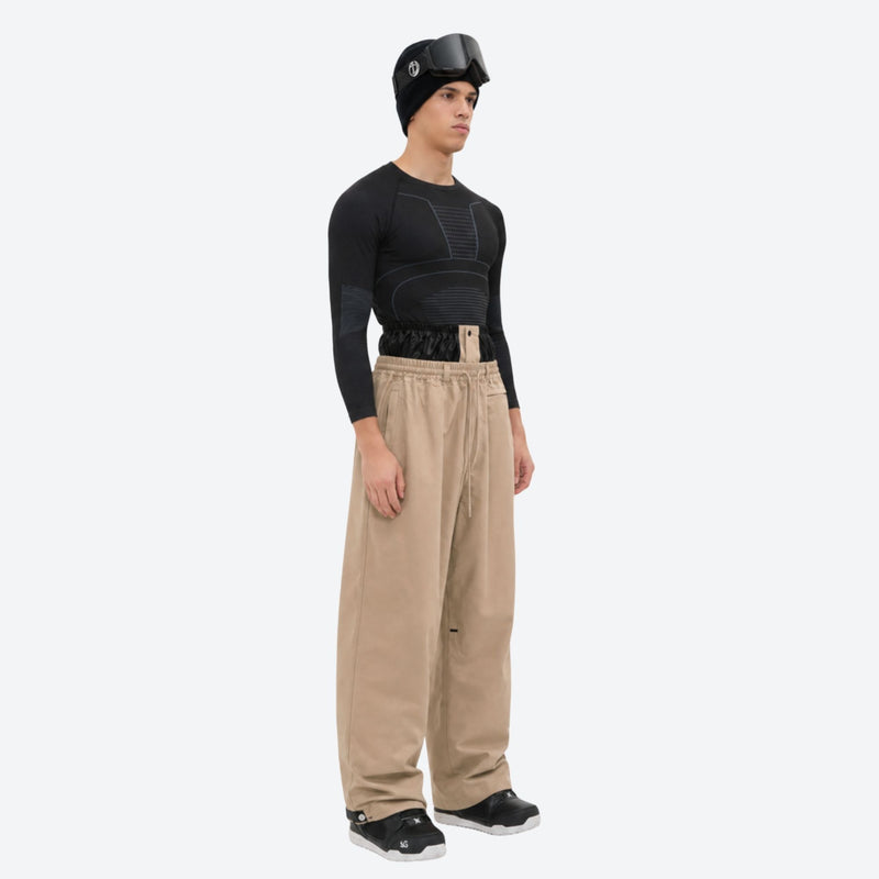 Men's 2-layer snowboard jacket and pants - tan snow pants, on-model side view, for cold-weather winter sports
