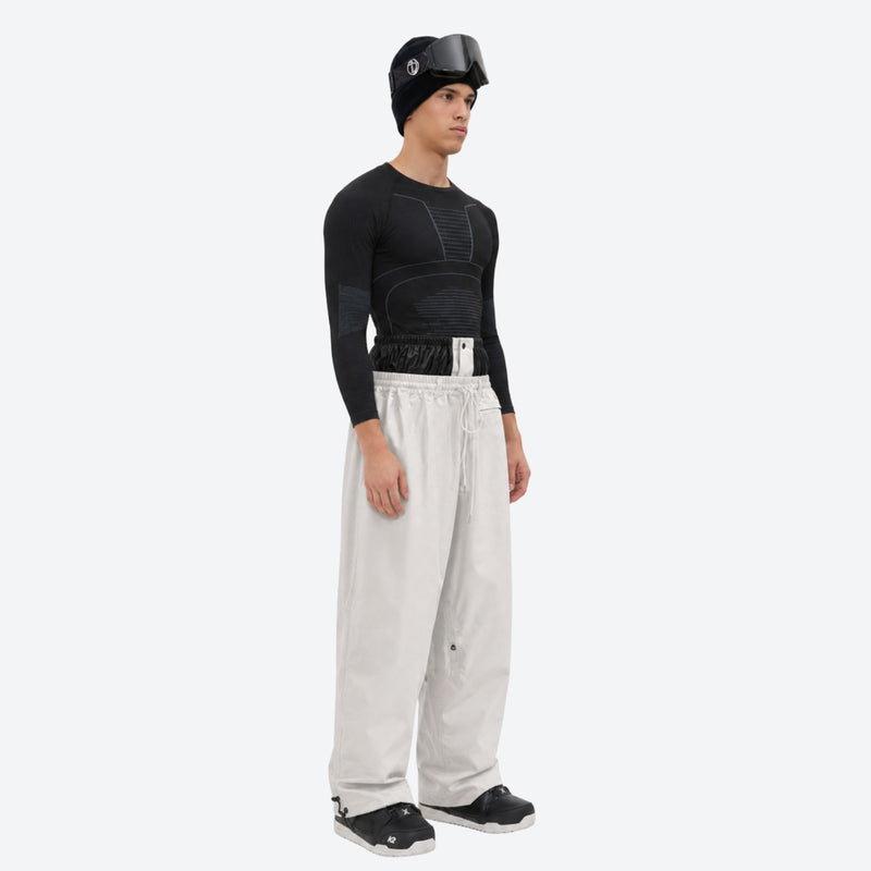 Men's 2-layer snowboard jacket and pants - cream snow pants, on-model side view, for cold-weather winter sports