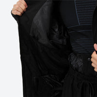 
                  
                    Men's 2-layer snowboard jacket and pants - black, interior lining close-up with hand, for powder days and winter commute
                  
                