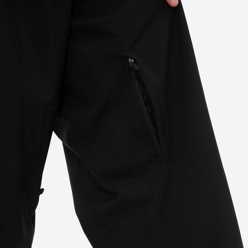 Men's minimalist breathable ski jacket set - black snow pants, thigh zip vent close-up detail, for skiing and snowboarding