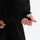 Men's waterproof 2L snow jacket and pants - black, cuff strap close-up with hand, for powder days and winter commute
