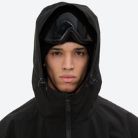 
                  
                    Men's waterproof 2L snow jacket and pants - black, hood and face close-up with goggles, for resort and street wear
                  
                