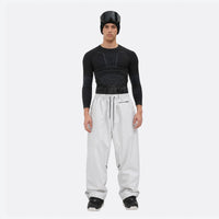 
                  
                    Men's 2-layer snowboard jacket and pants - white snow pants, on-model front view, for cold-weather winter sports
                  
                