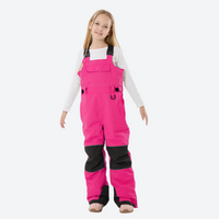 
                  
                    Kids breathable snowboard jacket and bib pants set - magenta bib pants with black knee patches, kids on-model front view
                  
                
