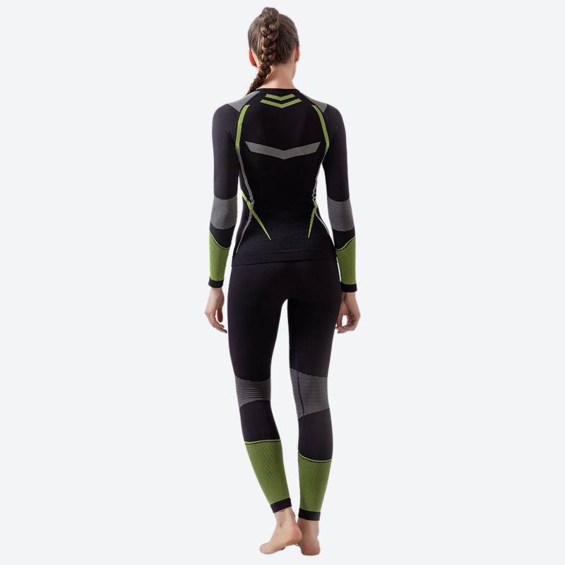 Women's compression base layer suit with lycra - black and green compression base layer suit on women, back standing view