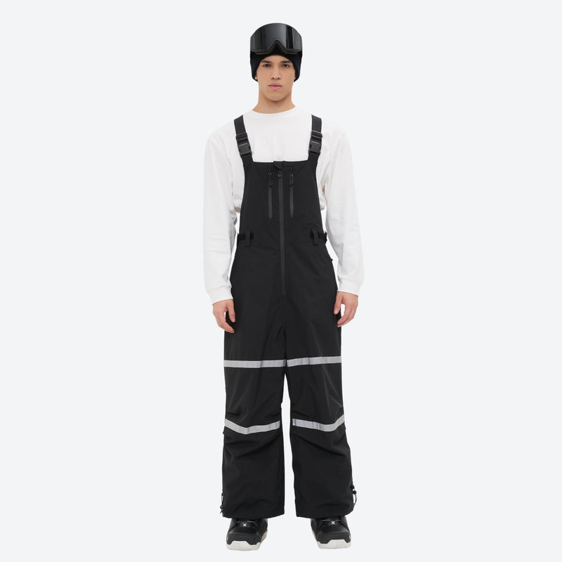 Unisex snowboard bib pants - black bib pants with white top, on-model front view, for skiing and snowboarding