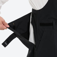 
                  
                    Breathable 3-layer suspender bibs with reflective trim - black bib pants, for powder days and winter commute
                  
                