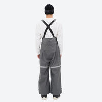 
                  
                    Unisex waterproof 3L bib snow pants - gray bib pants with white top, on-model back view, for resort and street wear
                  
                