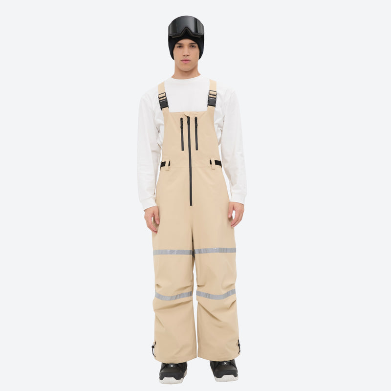 Unisex snowboard bib pants - tan bib pants with white top, on-model front view, for powder days and winter commute