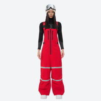 
                  
                    Women's reflective trim ski jacket with suspender bibs - red bib pants, on-model front view, for cold-weather winter sports
                  
                