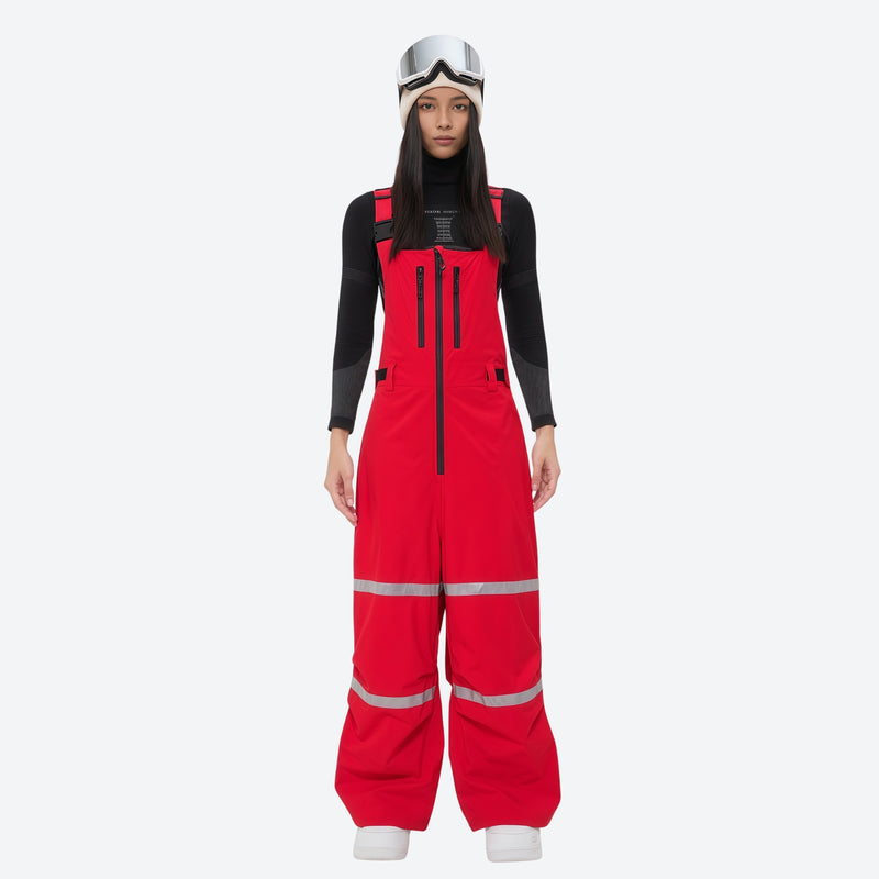 Women's reflective trim ski jacket with suspender bibs - red bib pants, on-model front view, for cold-weather winter sports