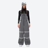 
                  
                    Women's 2-layer breathable snowboard jacket and bibs - gray bib pants, for powder days and winter commute
                  
                