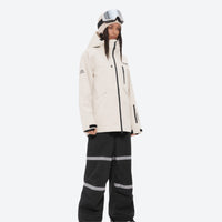 
                  
                    Women's waterproof 2L snow jacket and bib pants series - cream jacket with black bib pants, for skiing and snowboarding
                  
                