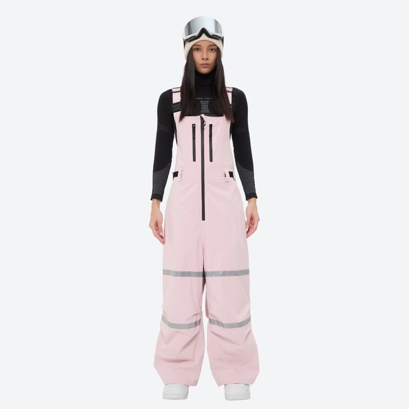 Unisex snowboard bib pants - pink bib pants with black top, on-model front view, for skiing and snowboarding