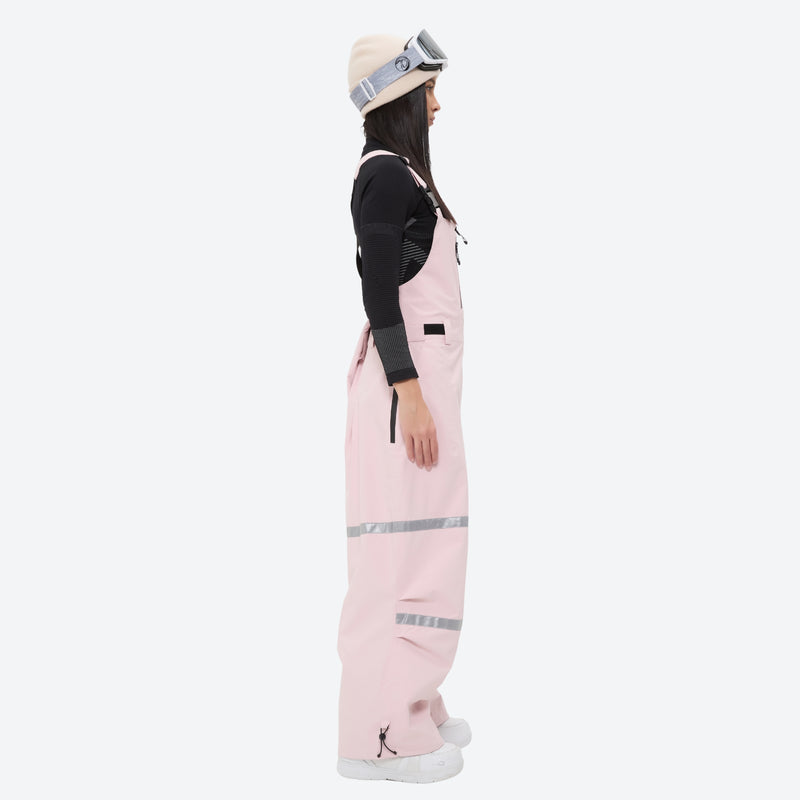 Breathable 3-layer suspender bibs with reflective trim - pink bib pants with black top, for powder days and winter commute