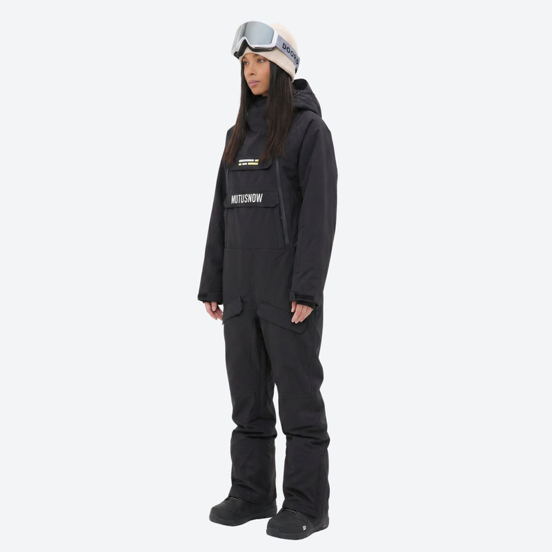 Women's waterproof 2L one-piece snow suit - black one-piece snow suit, on-model side view, for resort and backcountry days