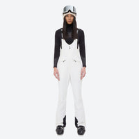 
                  
                    Women's fur trim hood snow jacket with suspender bibs - white bib pants, on-model front view, for skiing and snowboarding
                  
                