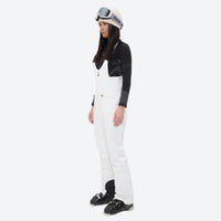 
                  
                    Women's fur trim hood snow jacket with suspender bibs - white bib pants, for snowy mountain travel
                  
                