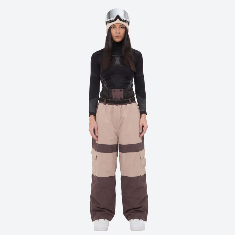 Women's 3-layer snowboard jacket and pants - tan and brown colorblock snow pants with black top, on-model front view