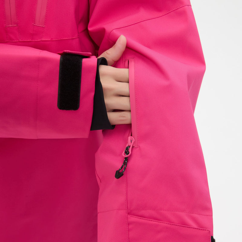 Women's waterproof 3L anorak snow jacket and pants - rose pink, cuff strap close-up with hand, for powder and piste riding