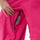 Women's breathable ski pullover set - rose pink snow pants, knee zip vent close-up with hand, for resort and backcountry days