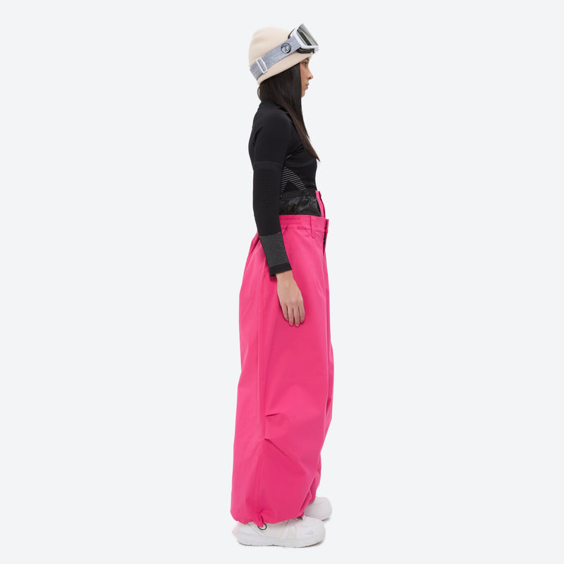 Women's breathable ski pullover set - rose pink snow pants, on-model side view, for cold-weather winter sports