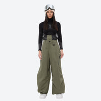 
                  
                    Women's waterproof 3L anorak snow jacket and pants - olive green snow pants, on-model front view, for skiing and snowboarding
                  
                