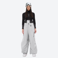 
                  
                    Women's 3-layer snowboard anorak and pants - light gray snow pants, on-model front view, for resort and backcountry days
                  
                