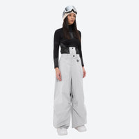 
                  
                    Women's breathable ski pullover set - light gray snow pants, on-model front view, for cold-weather winter sports
                  
                