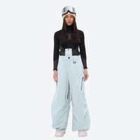 
                  
                    Women's 3-layer snowboard anorak and pants - ice blue snow pants, on-model front view, for skiing and snowboarding
                  
                
