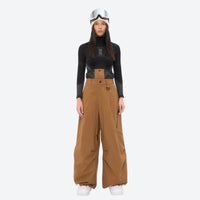 
                  
                    Women's waterproof 3L anorak snow jacket and pants - tan snow pants, on-model front view, for cold-weather winter sports
                  
                