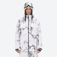 
                  
                    Women's 3-layer snowboard jacket and pants - white marble print jacket, on-model front view, for resort and backcountry days
                  
                