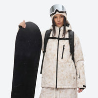 
                  
                    Unisex printed snowboard jacket and bibs - cream tan marble print, for skiing and snowboarding
                  
                