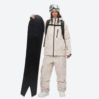 
                  
                    Breathable 3-layer ski jacket and suspender pants set - cream tan marble print, for powder and piste riding
                  
                