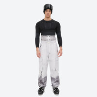 
                  
                    Unisex printed snowboard jacket and bibs - white marble print bib pants, on-model front view, for resort and backcountry days
                  
                