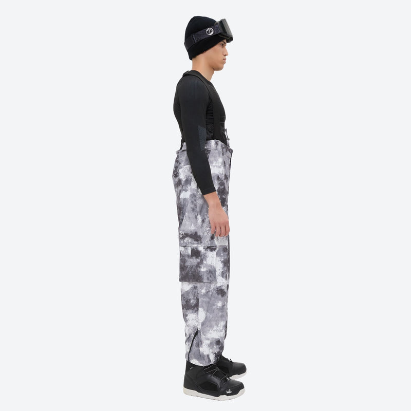 Unisex printed snowboard jacket and bibs - gray camo marble print bib pants, on-model side view, for skiing and snowboarding